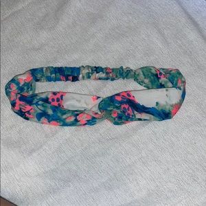 Pink, blue, green, and white knotted headband